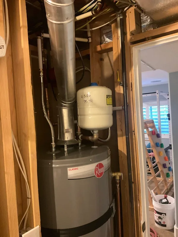Rheem gas water heater and expansion tank in a closet in a Utah home