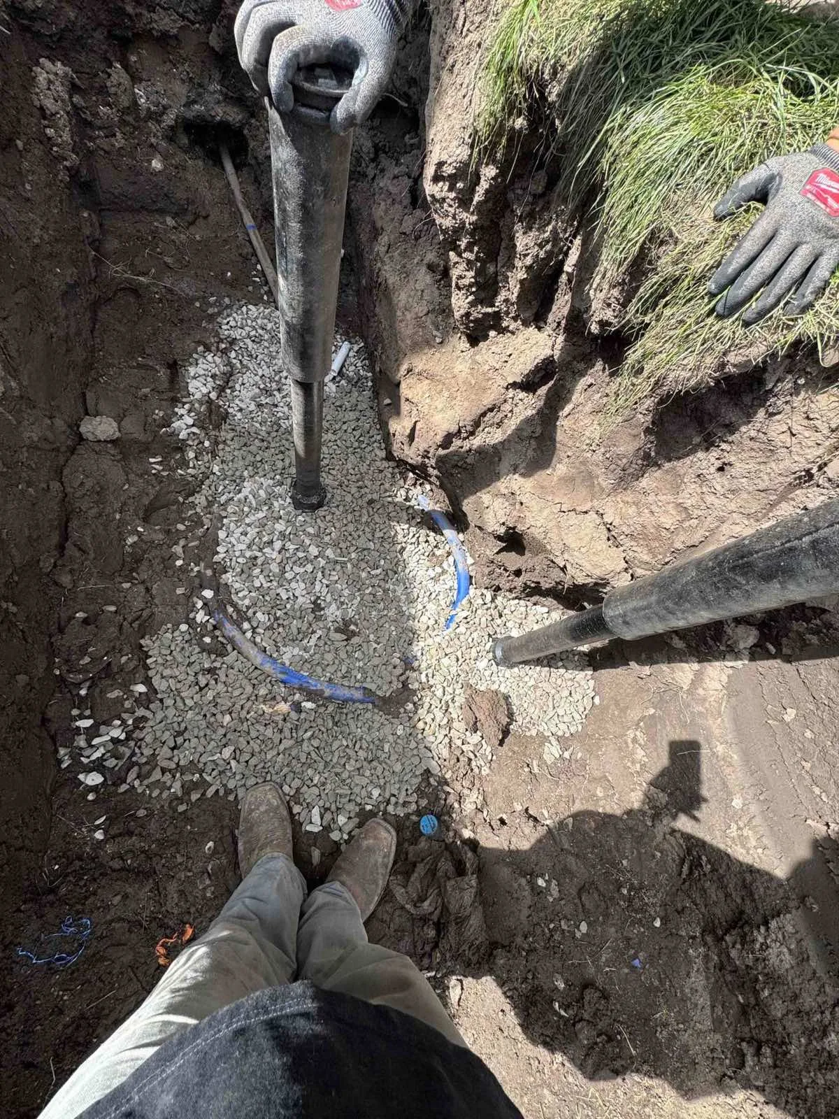 Water service line replacement in a gravel-bedded excavation by Rare Breed Plumbing in Utah