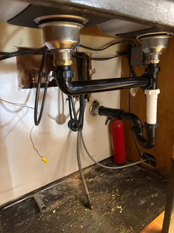 Under-sink drain plumbing serviced by Rare Breed Plumbing in Utah