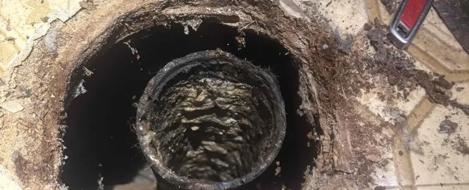 Corroded cast-iron drain line opened for cleaning by Rare Breed Plumbing in Utah
