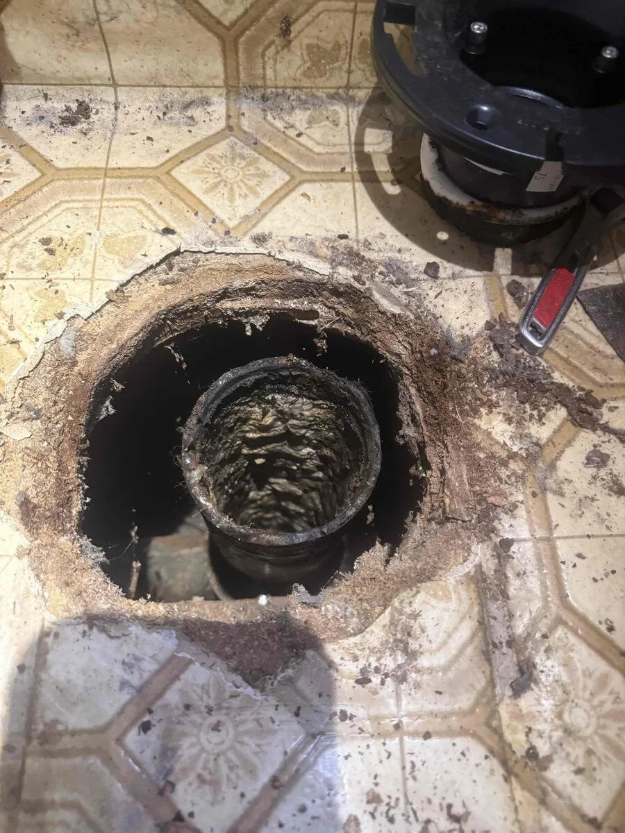 Corroded cast-iron drain pipe exposed by Rare Breed Plumbing in Utah