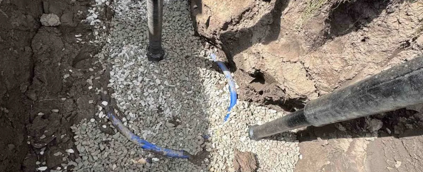 Main water service line bedded in gravel by Rare Breed Plumbing in Utah