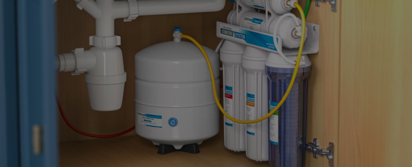 Under sink reverse osmosis drinking water system with storage tank and filter housings