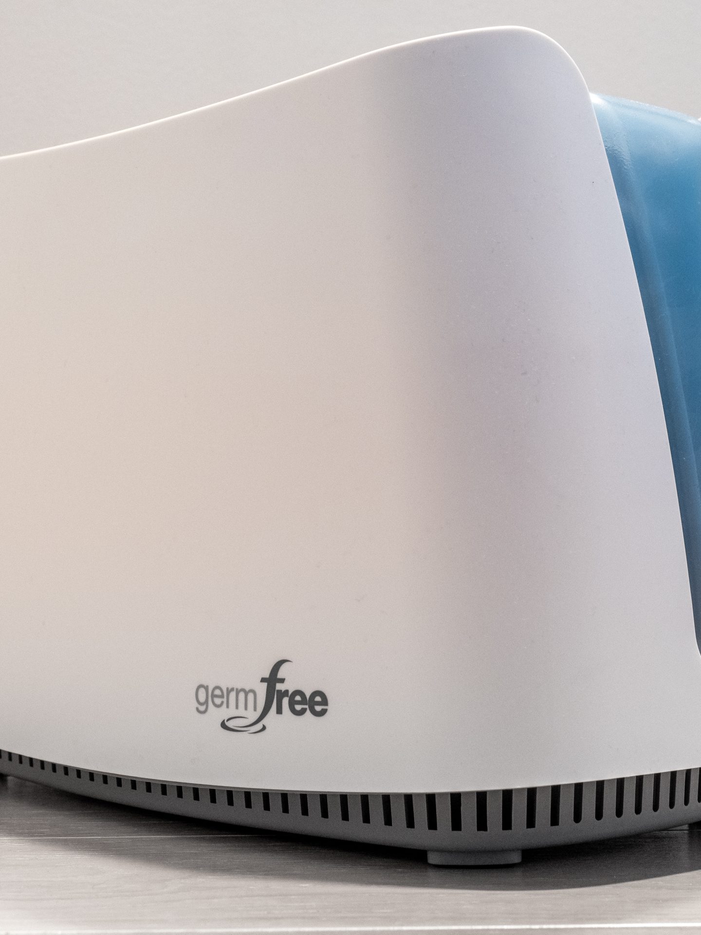 Portable consumer air purifier on a floor