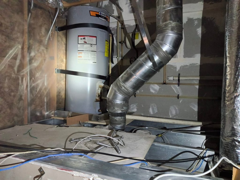 Water heater and flue in an unfinished attic space