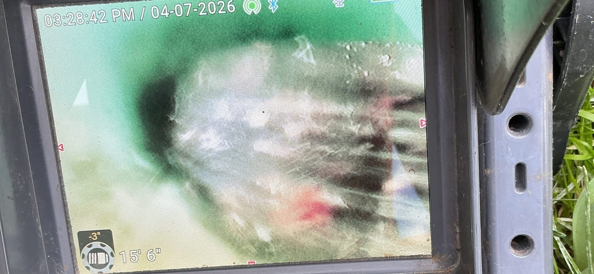 Sewer camera monitor showing the inside of a main line with the on-screen distance readout during an inspection